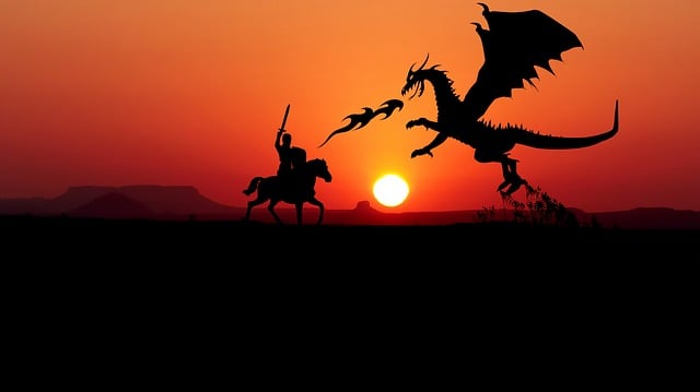 Silhouette noire de chevalier combattant un dragon devant un ciel rouge de soleil couchant